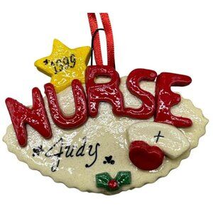 Orianda's Christmas tree ornament 1999 Nurse Judy nurse hat heart star READ
